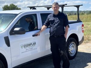 Exemplar Pest Solutions owner/operator Dave with a company truck